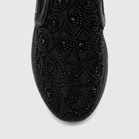 Close-up view of a black Morbido Ladies Leather Sneaker with intricate beaded embellishments on the toe box and vamp.