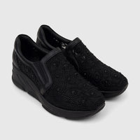 Pair of black Morbido Ladies Leather Sneakers with a studded mesh pattern and platform soles, shown from an elevated angle.