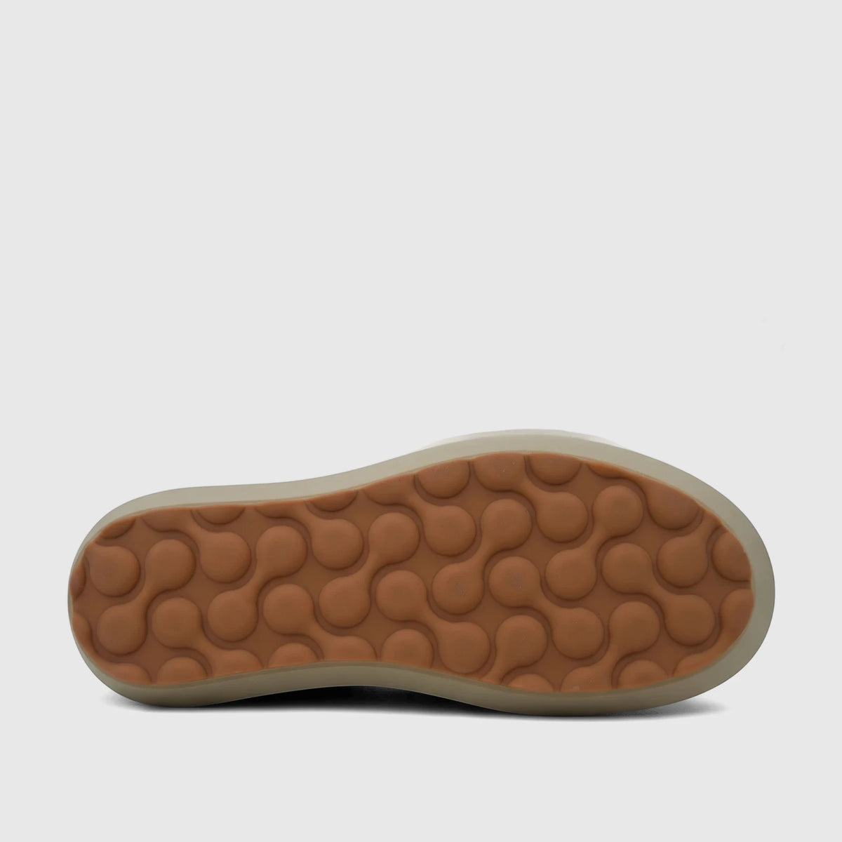 Brown and tan sole of a Morbido ladies' leather sneaker, showcasing a unique connected-bubble pattern on its rubber outsole.