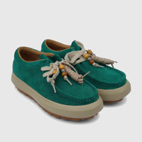 Morbido Ladies Leather Sneakers in vibrant green suede, featuring chunky platform soles and unique beaded cream laces.