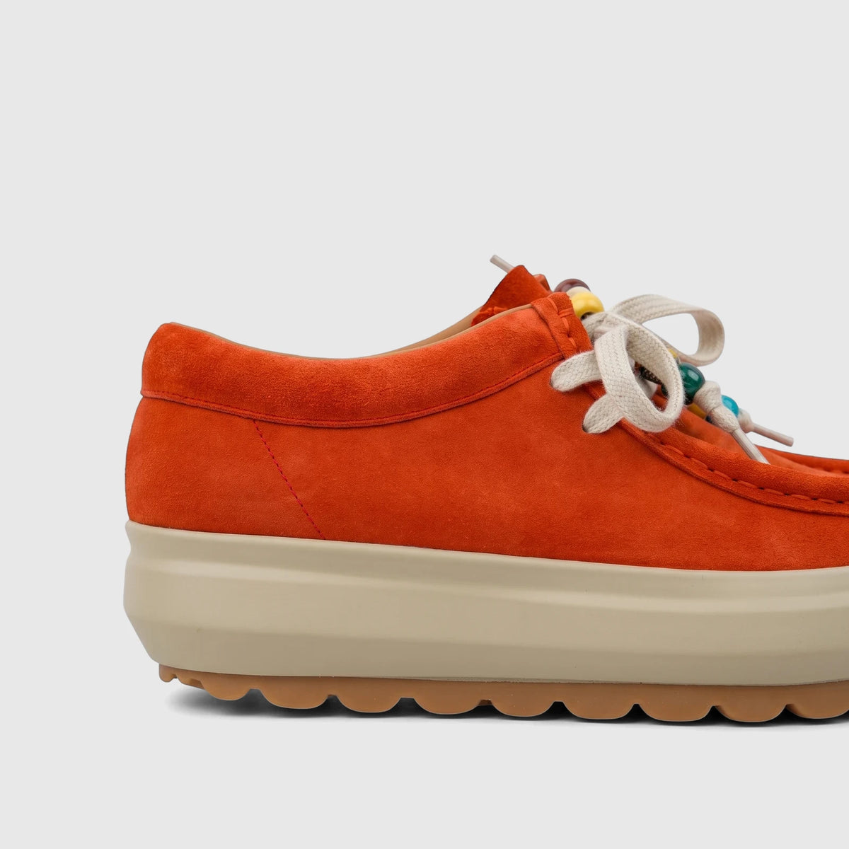 Morbido Ladies Leather Sneaker in vibrant orange suede with a thick beige platform sole and off-white laces with colorful