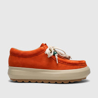 Side view of an orange suede Morbido Ladies Leather Sneaker HAS-001 with white laces and a thick beige sole.