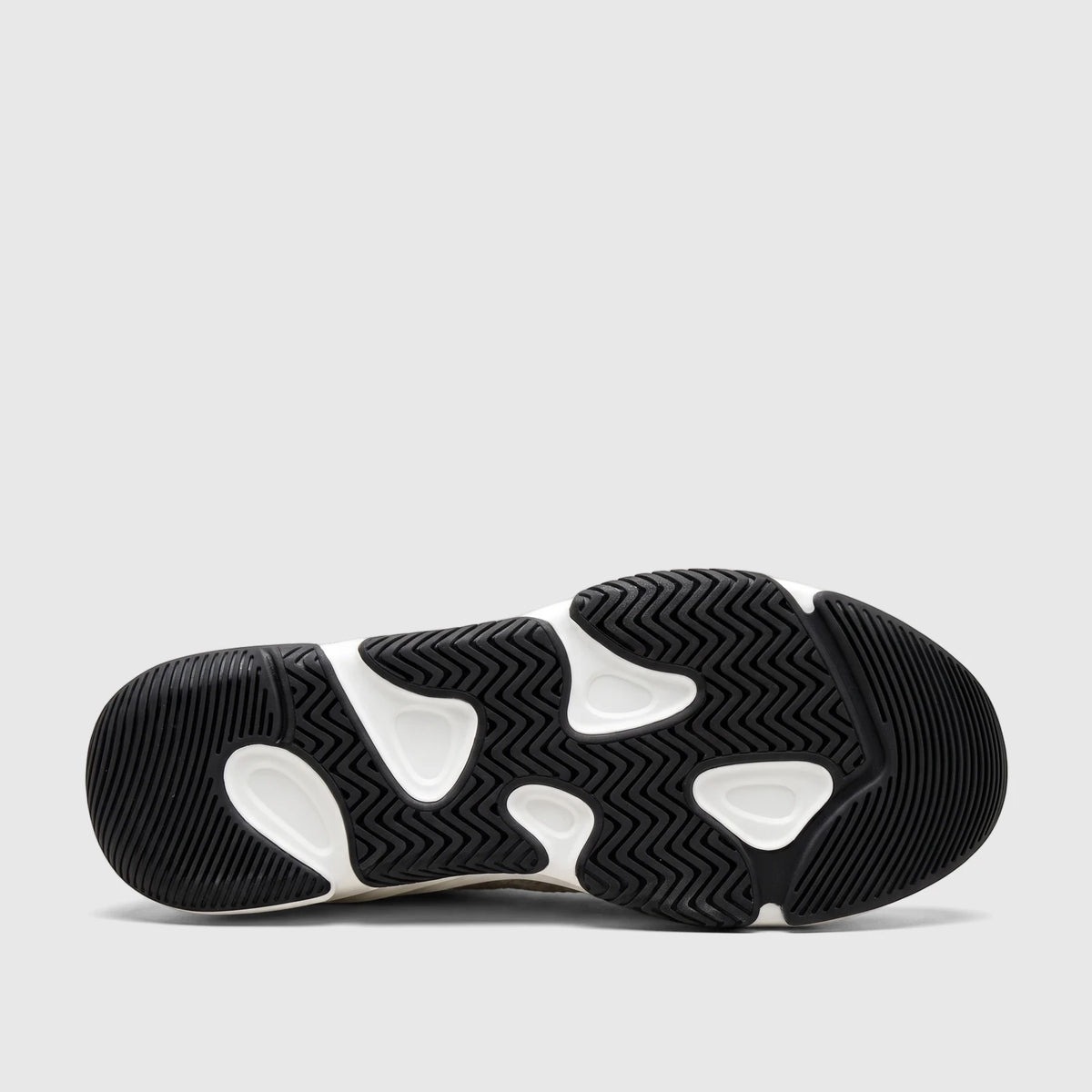 Bottom view of a Morbido Ladies Leather Sneaker White, showcasing its black and white patterned sole and durable