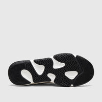 Bottom view of a Morbido Ladies Leather Sneaker White, showcasing its black and white patterned sole and durable