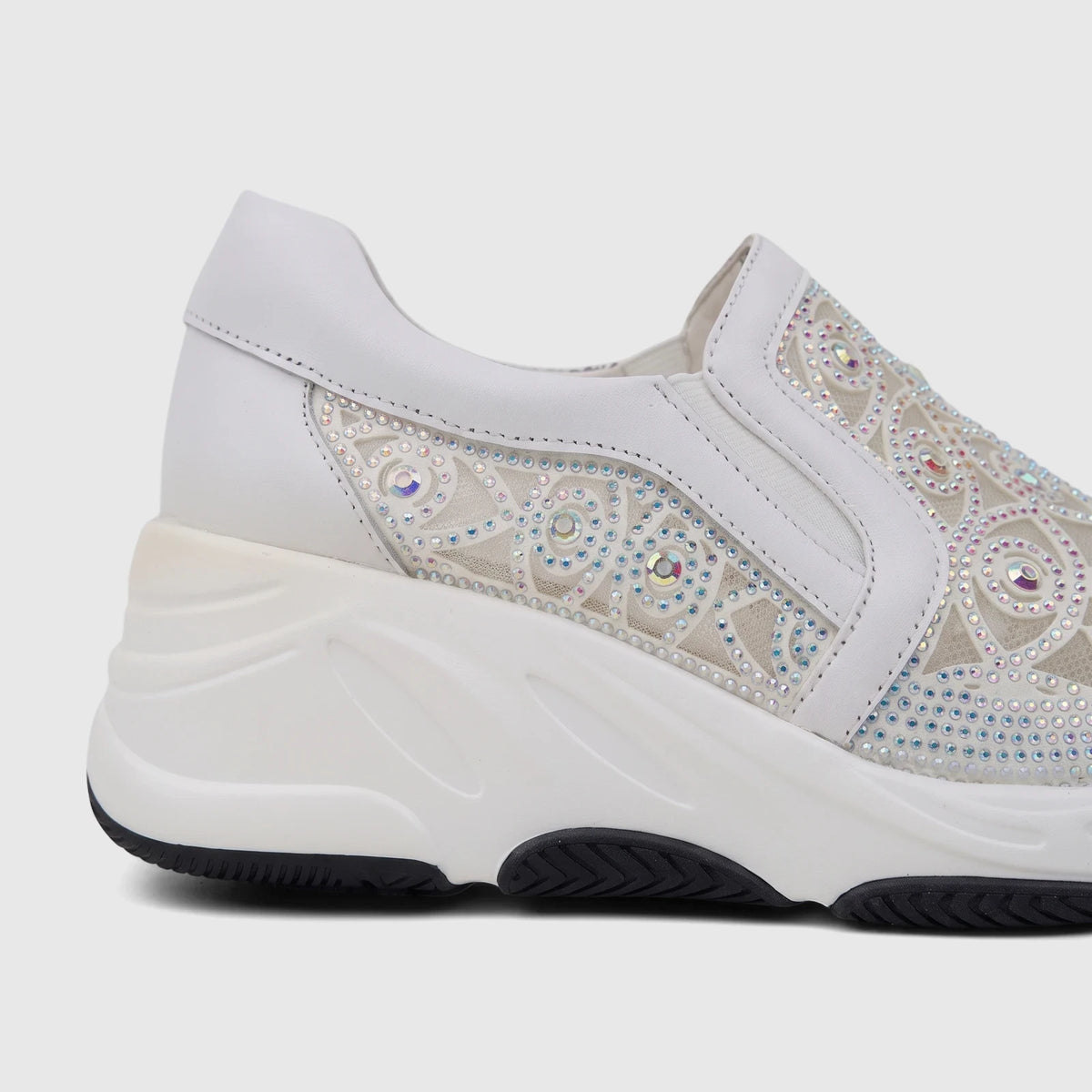 Close-up of a white Morbido Ladies Leather Sneaker HAS-002 with rhinestone embellished mesh panels and a chunky white sole.