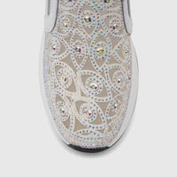 Close-up of a white Morbido Ladies Leather Sneaker with iridescent rhinestones in an intricate pattern on the upper, showing
