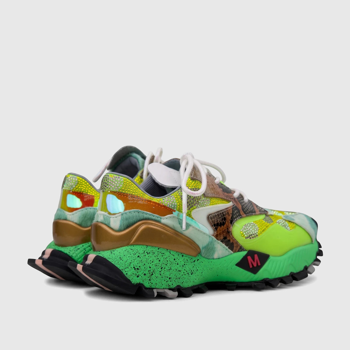 Rear-side view of Morbido Ladies Leather Sneakers Green Multi, featuring iridescent panels, snake print, and speckled green