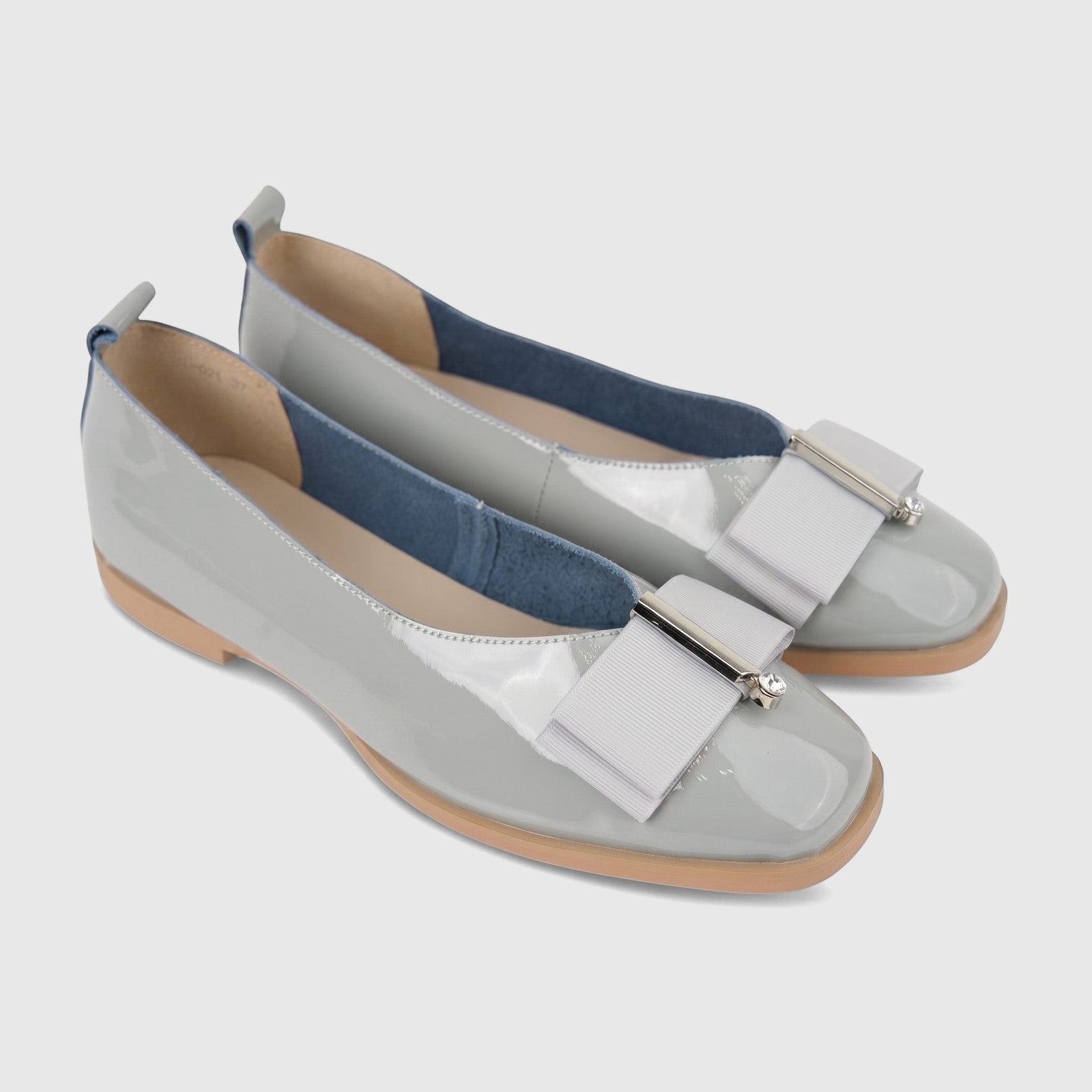 Pair of Morbido ladies' light grey patent leather pumps with square toes and grosgrain ribbon bows.