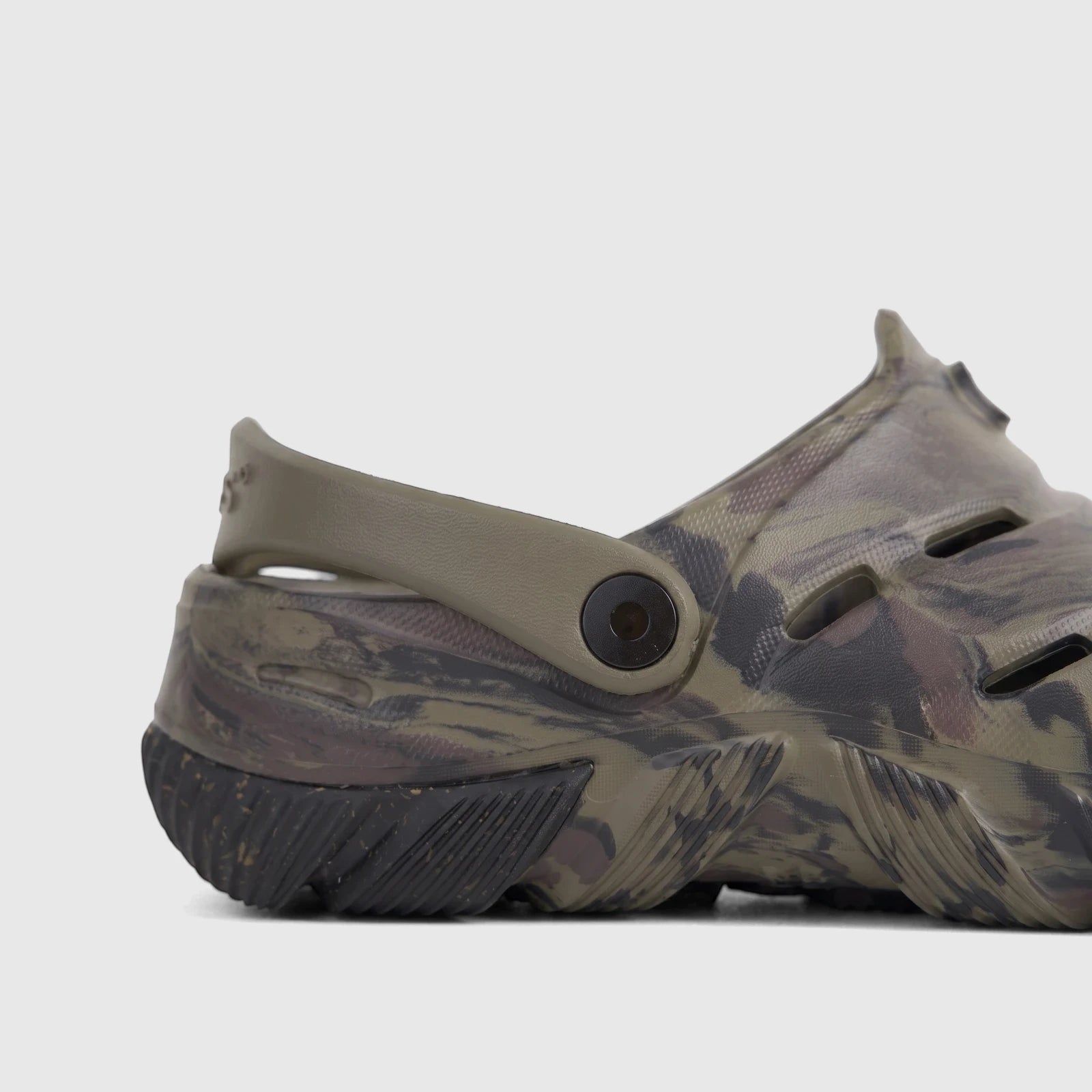 Side view of an ogs By Florsheim Men's Comfort Clog Boga in a khaki and camouflage pattern with a black sole.