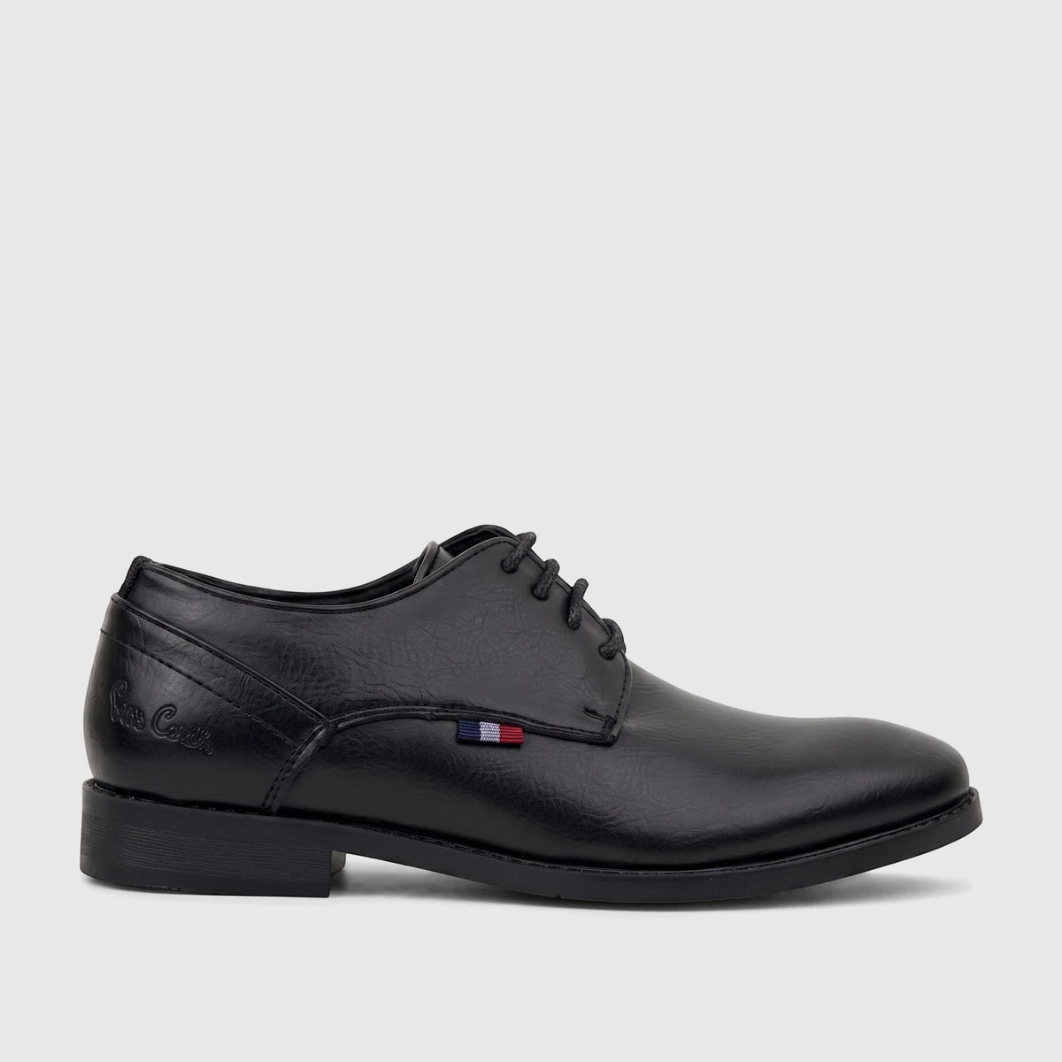 Black PC Boys dress lace-up shoe in a smooth finish, with a low heel, viewed from the side.