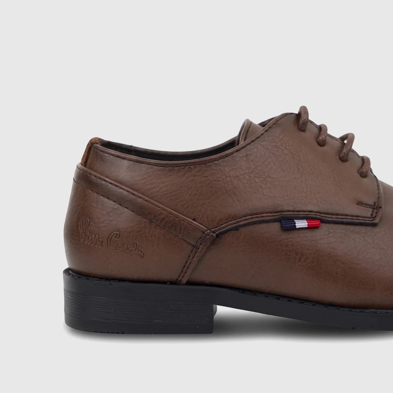 Brown leather-look boys' dress lace-up shoe with a side-profile view, suitable for formal wear.