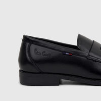Side view of a black Pierre Cardin youth slip-on dress loafer shoe, featuring a shiny finish and a subtle striped detail.
