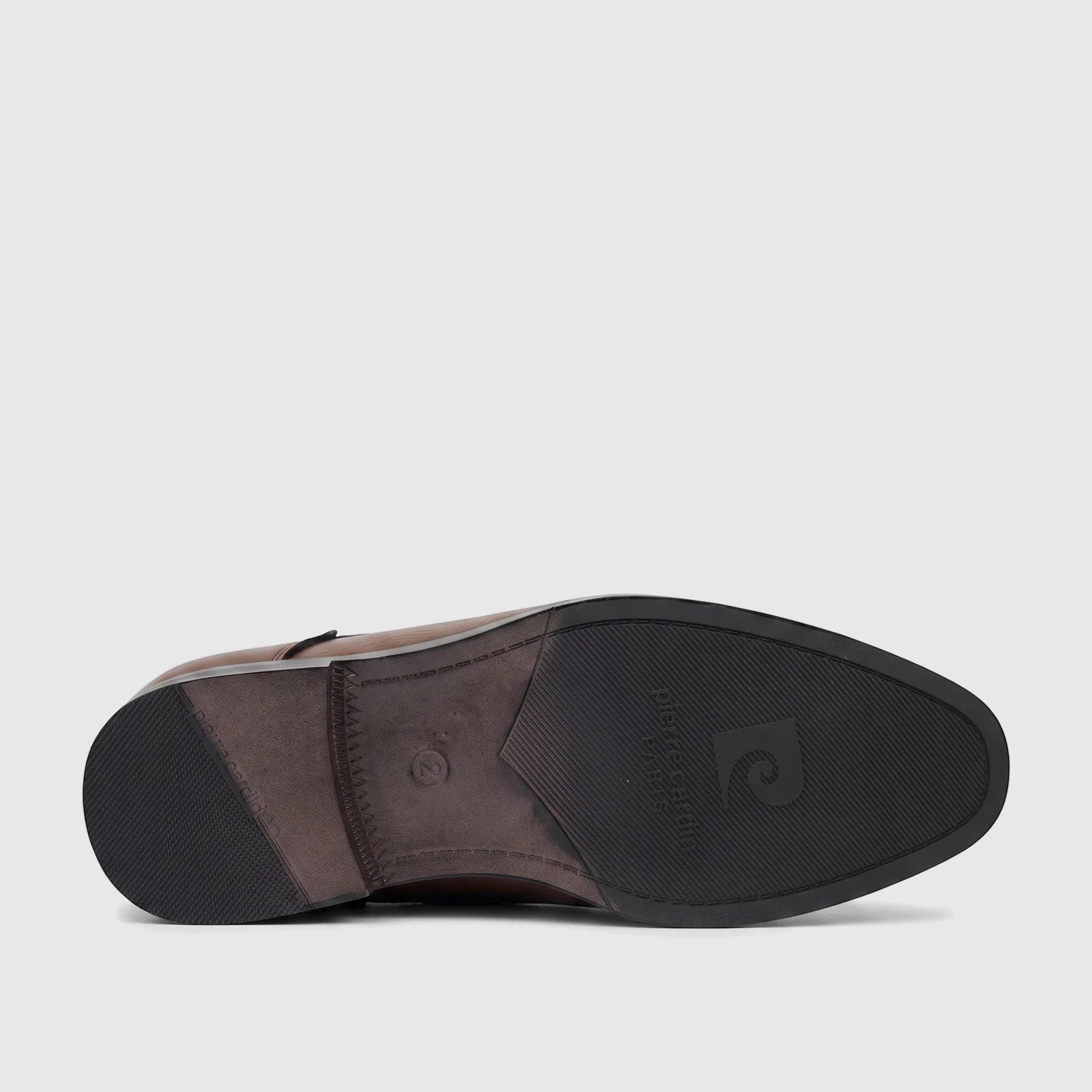 Brown leather dress lace-up shoe for boys. Sole view highlights the black rubber sole with brand logo and textured heel,