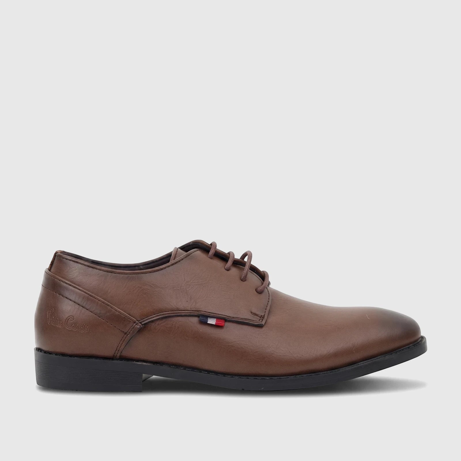 Brown leather lace-up dress shoe for boys from the PC Boys Youth collection, shown in a side profile view.