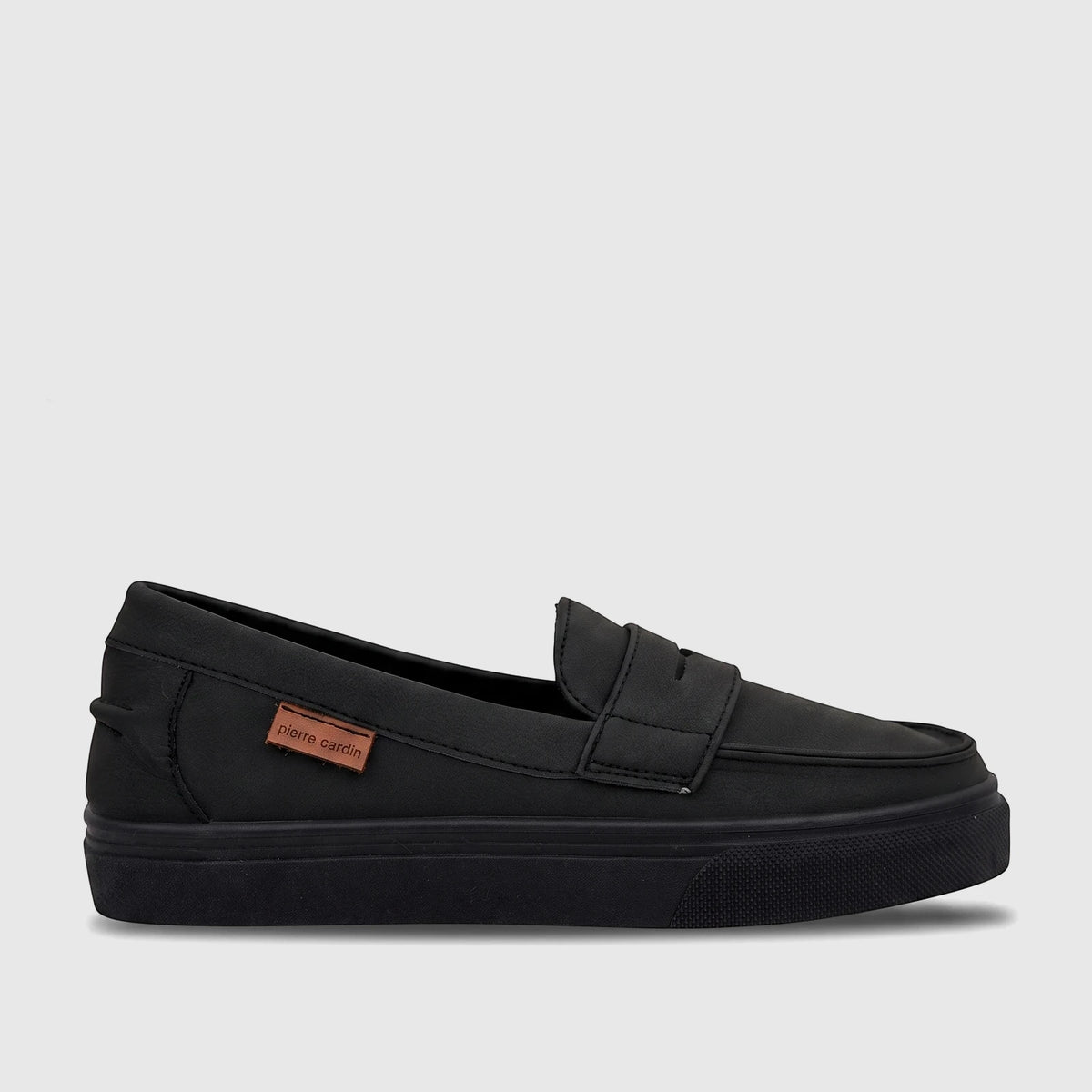Black Pierre Cardin youth casual slip-on shoe, designed for comfort and ease, viewed from the side.