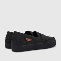 Black Pierre Cardin casual slip-on shoes for boys youth, featuring a flat sole and a brand tag on the side.