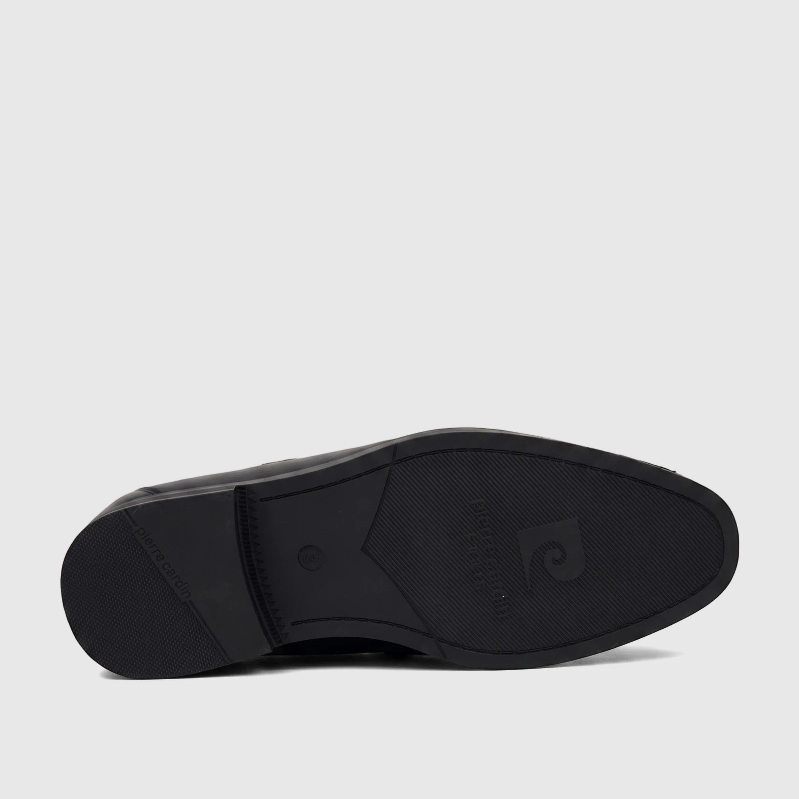 Black Pierre Cardin slip-on dress shoe for boys, shown from the sole view highlighting branding and size.