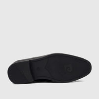 Black Pierre Cardin slip-on dress shoe for boys, shown from the sole view highlighting branding and size.