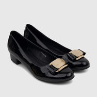 PC Ladies Black Patent Dress Court Shoes with Gold Buckle, a pair shown from a slightly elevated view on a white surface.