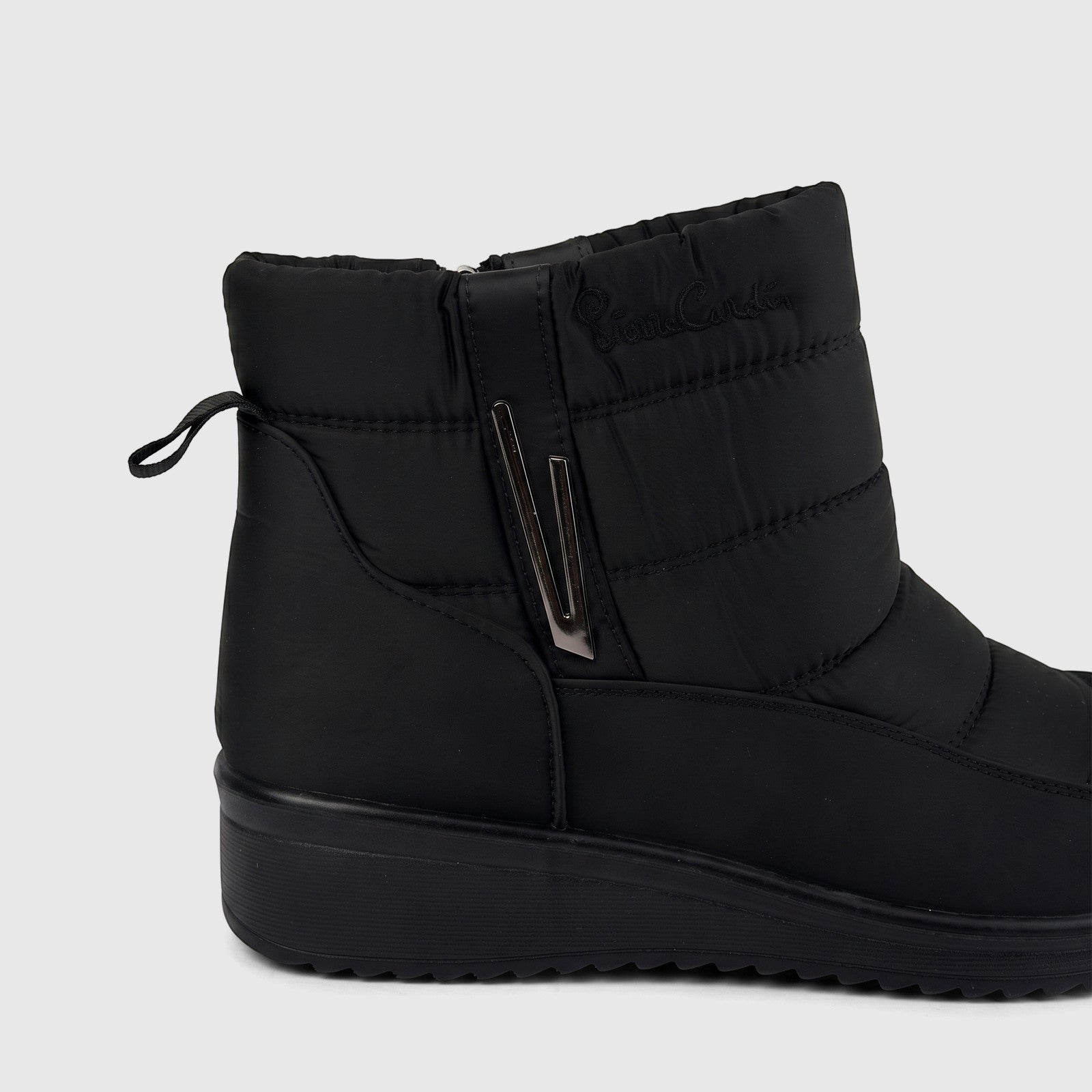 Black quilted casual ankle boot with a side zipper and subtle logo detail, presented from a side view.