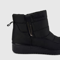 Black quilted casual ankle boot with a side zipper and subtle logo detail, presented from a side view.