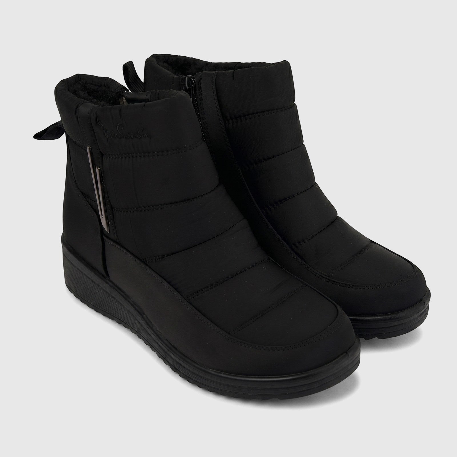 Black quilted casual ankle boots for ladies, featuring side zippers and a comfortable design, shown angled.