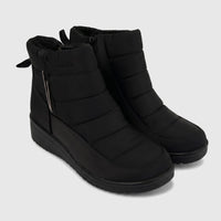 Black quilted casual ankle boots for ladies, featuring side zippers and a comfortable design, shown angled.