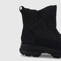 Black PC Ladies Casual Ankle Boot featuring a durable lug sole and warm faux fur lining, shown from a side view.