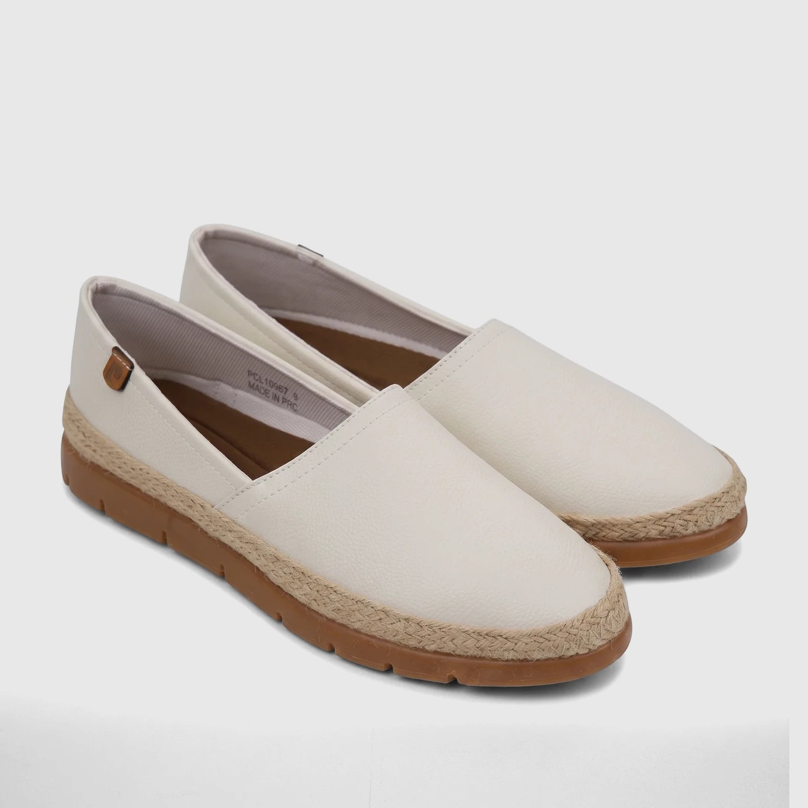A pair of white PC ladies casual espadrille loafers featuring a textured upper, natural jute trim, and brown rubber soles.