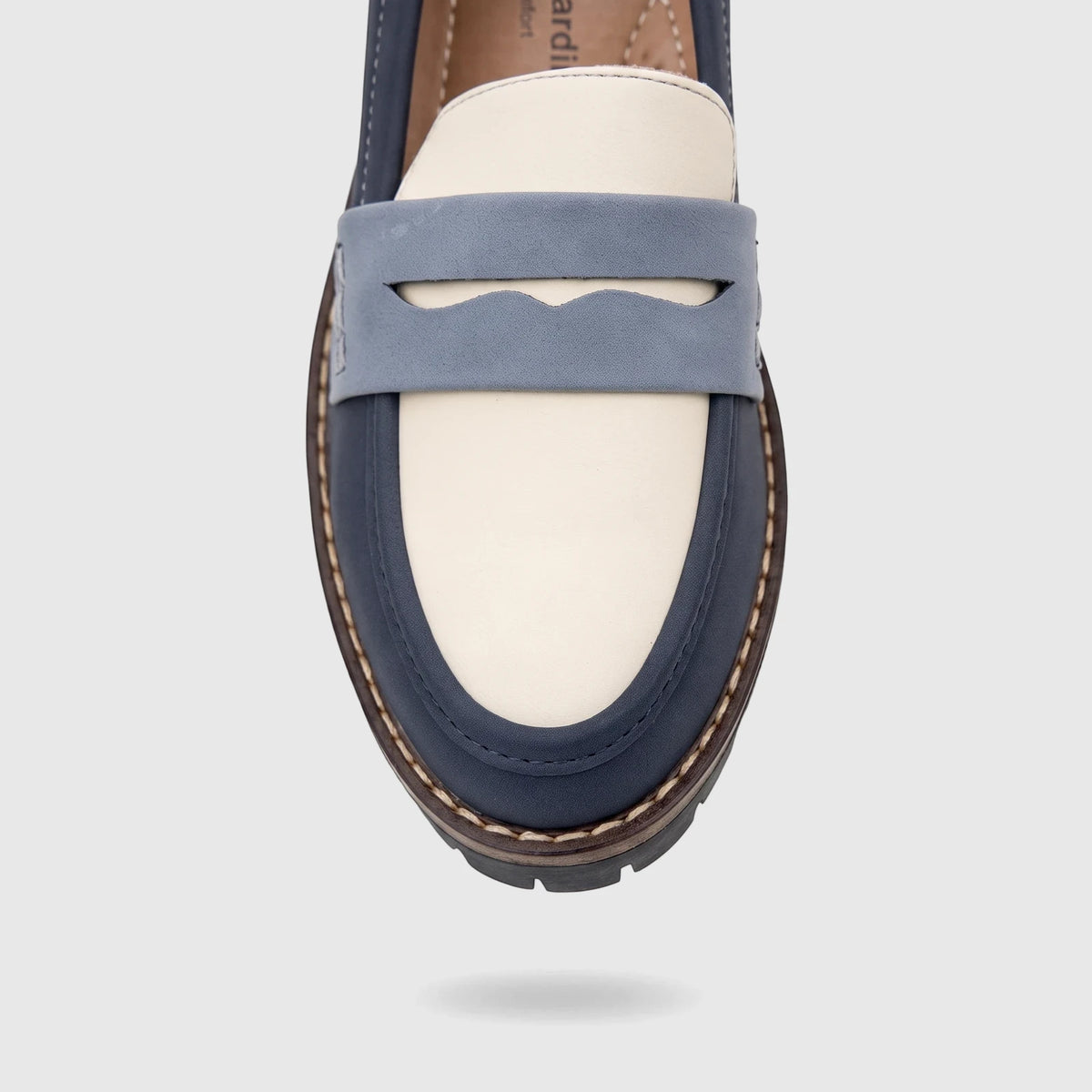 Close-up front view of a PC Ladies Casual Loafer in blue multi-color, showcasing navy, light blue, and off-white panels with