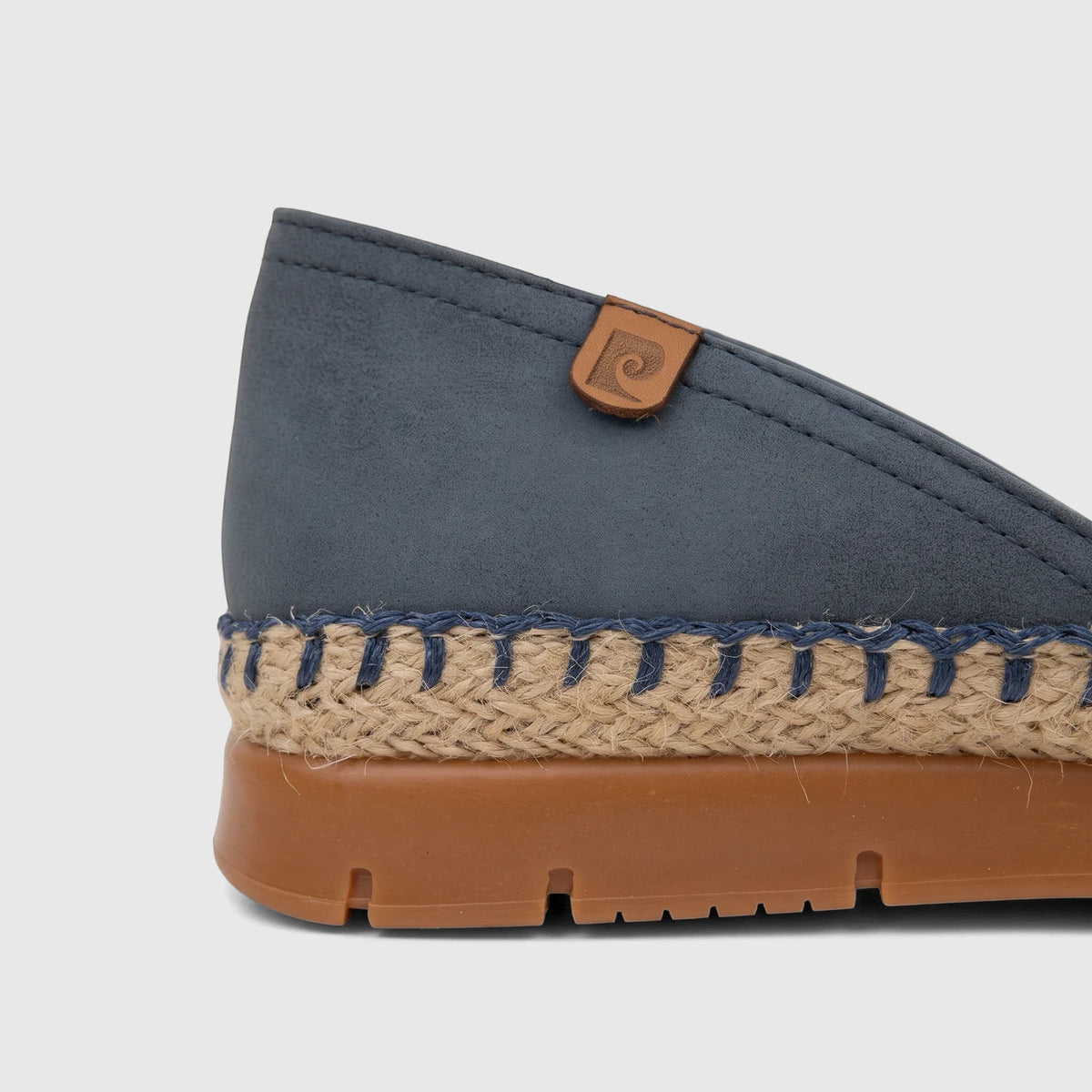 Close-up view of a denim blue PC Ladies Casual Loafer with a woven espadrille sole and brown rubber outsole.