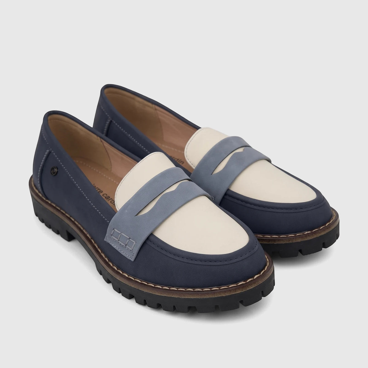 Close-up of a pair of PC Ladies Casual Loafer PCL10997 shoes in blue, cream, and light gray with thick lug soles, angled on