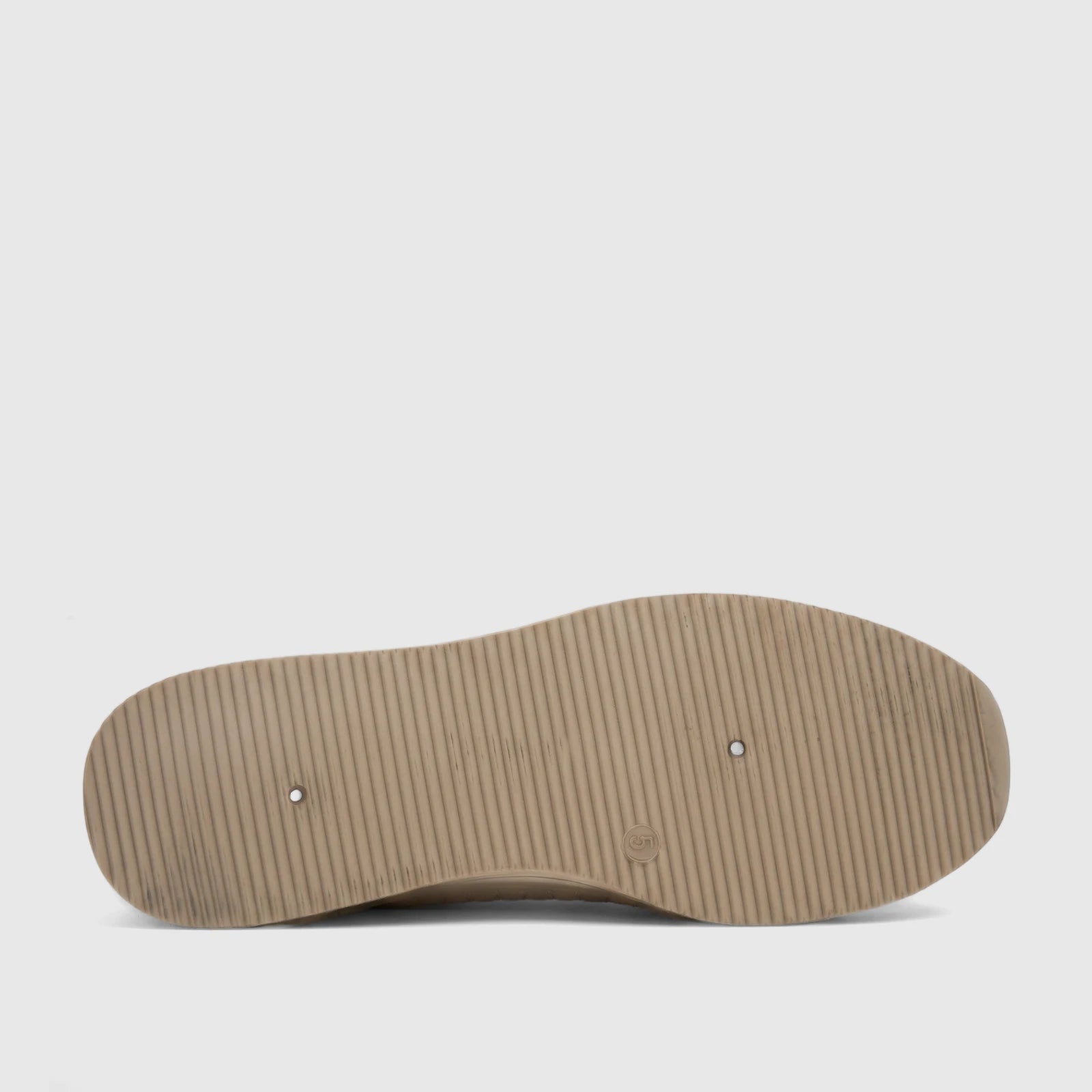 PC Ladies Casual Loafer in stone color, featuring a ribbed sole with two drainage holes, viewed from the underside.