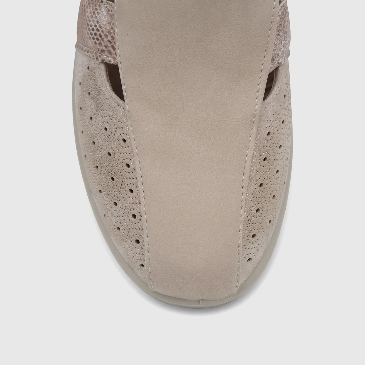Close-up of a beige PC Ladies Casual Pump with perforated details and a textured accent band, viewed from above.