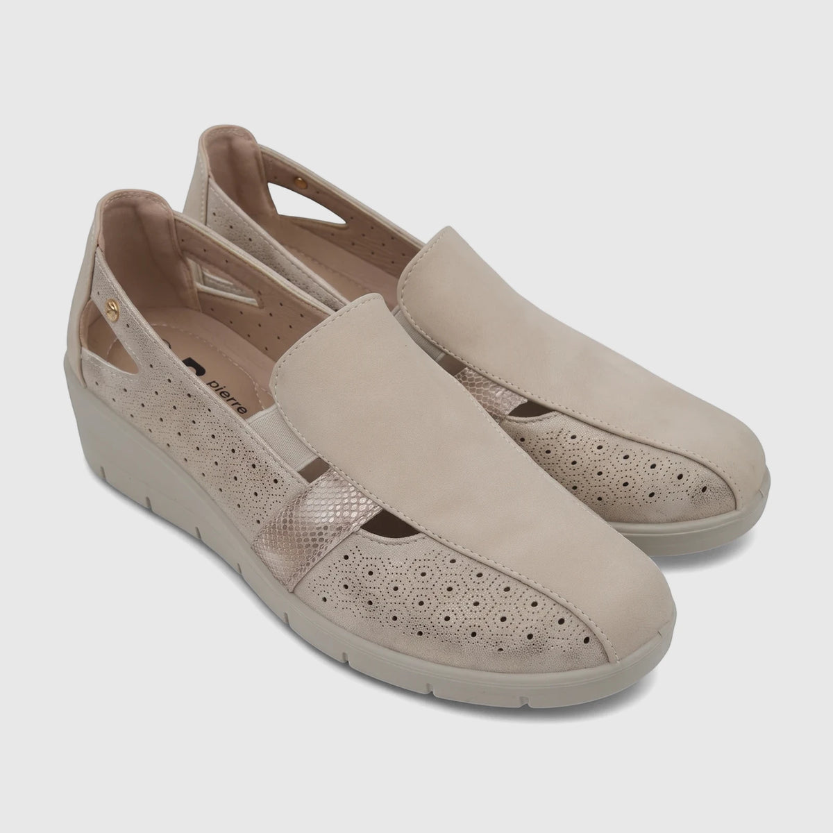Pair of PC Ladies Casual Pumps in beige, featuring perforated details and a snake-print texture, viewed from an eye-level