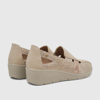 Two PC Ladies Casual Pumps in beige, featuring perforated details, cut-outs, and a wedge heel, seen from a rear side view.