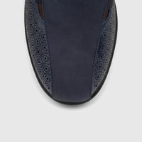 Close-up of a navy blue PC Ladies Casual Pump shoe, made of perforated leather, viewed from the top.