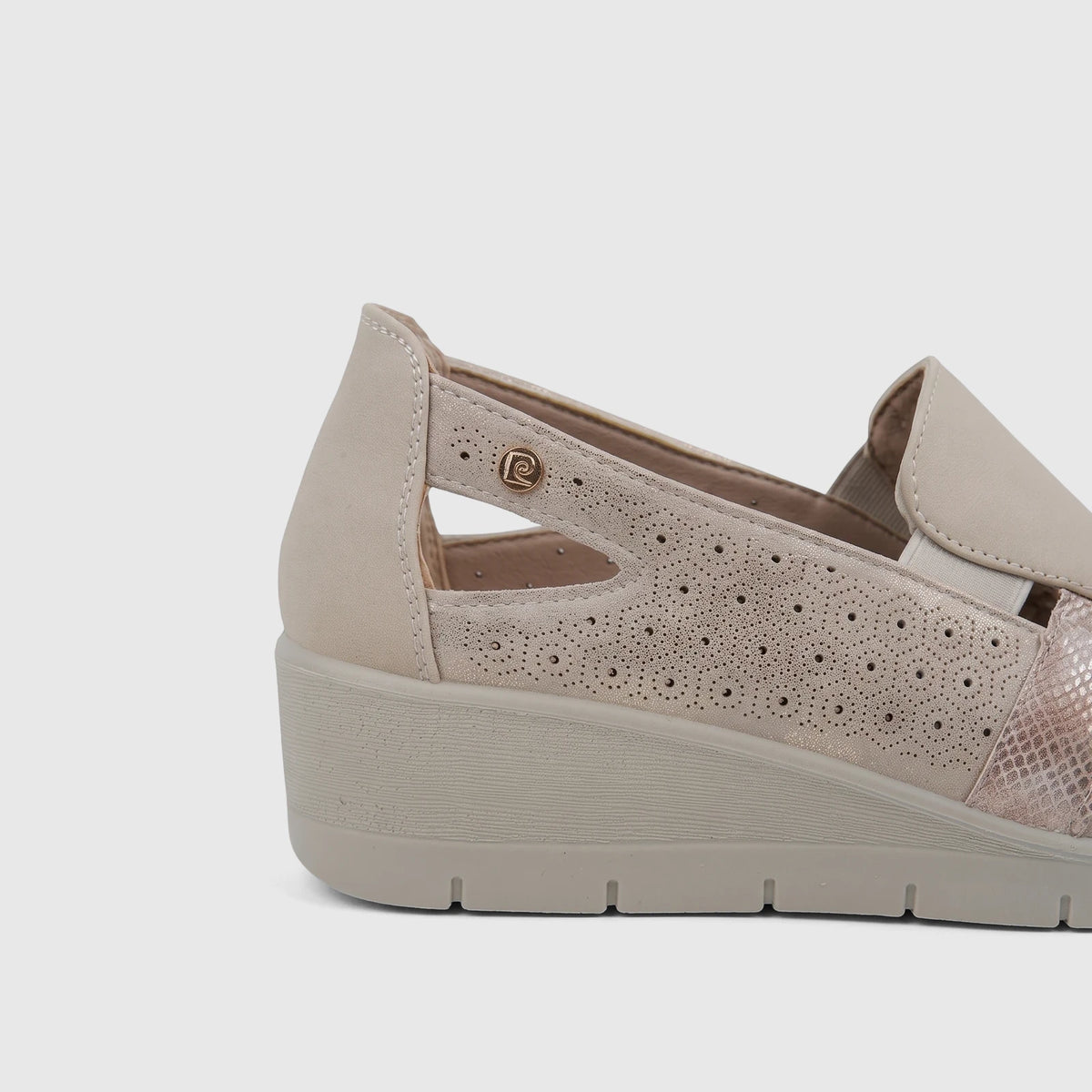 Close-up side view of a PC Ladies Casual Pump PCL10995 in beige, featuring perforated details and a wedge sole.