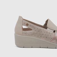 Close-up side view of a PC Ladies Casual Pump PCL10995 in beige, featuring perforated details and a wedge sole.