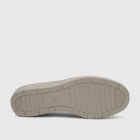 Close-up view of the beige sole of a PC Ladies Casual Pump, featuring a ridged pattern and an embossed number 5.