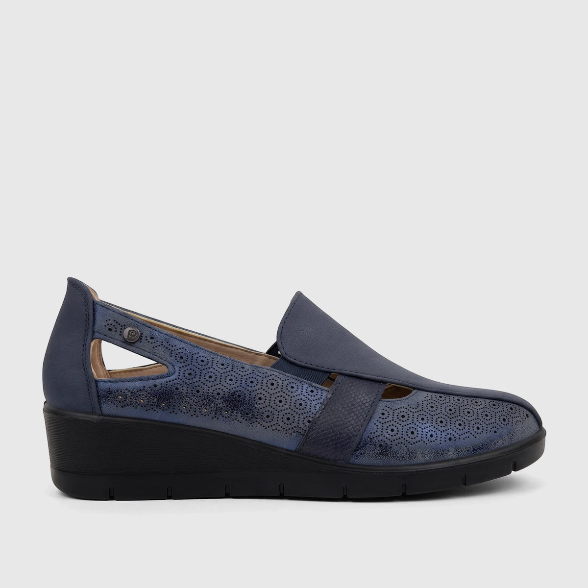 PC Ladies Casual Pump PCL10995 in navy blue with perforated design, strap detail, and wedge heel, side view.