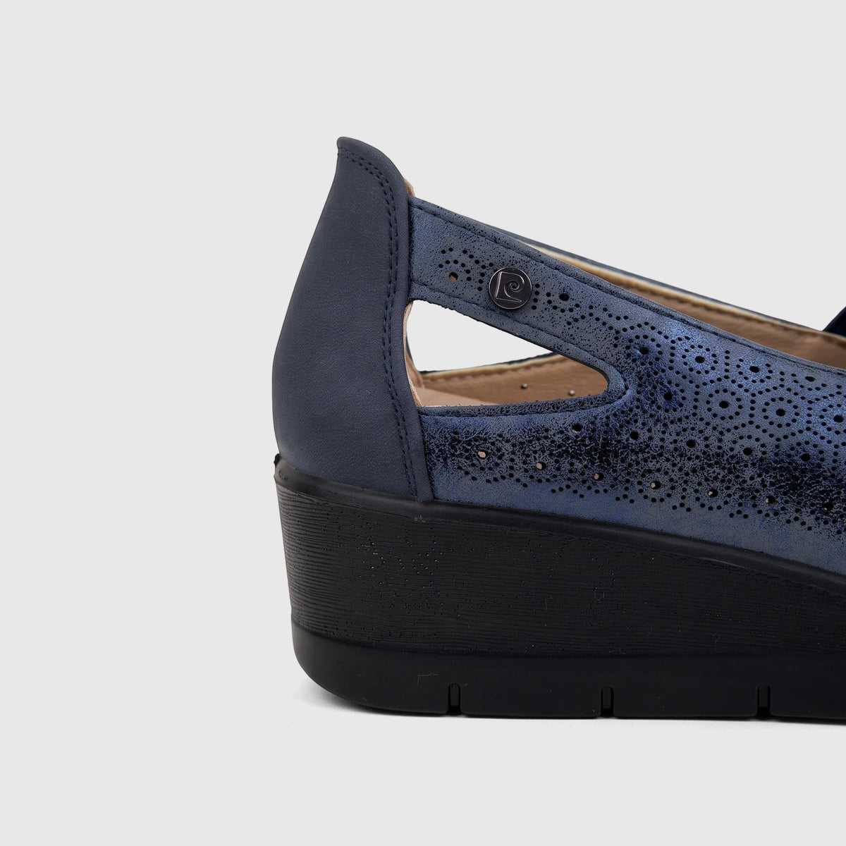 Navy blue PC Ladies Casual Pump PCL10995 with perforated upper and black wedge heel, viewed from the side.