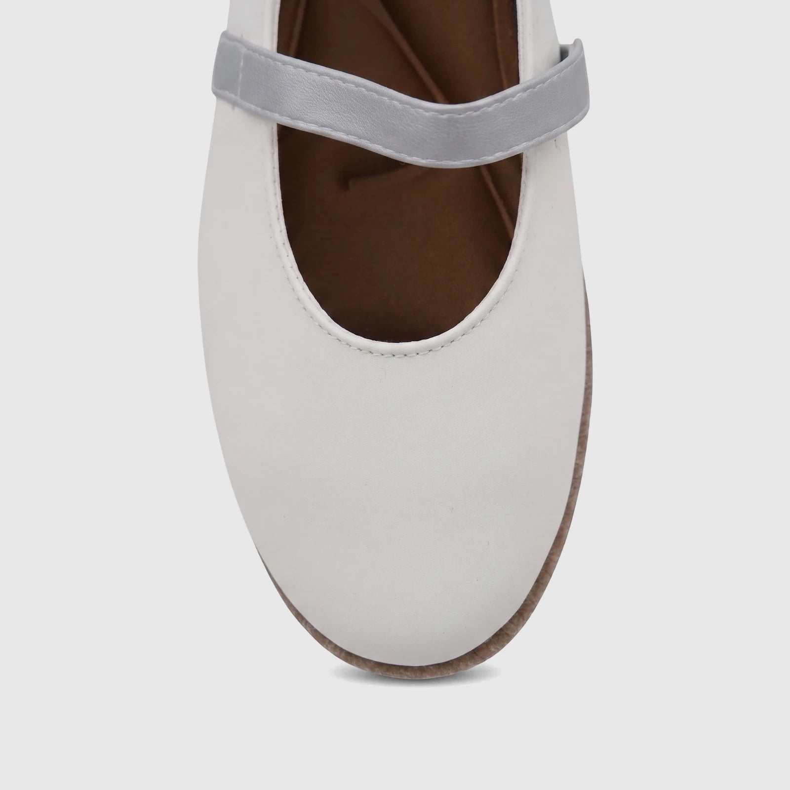 White PC Ladies Casual Pump shoe with a silver strap, shown from a high-angle view focusing on the instep and toe.