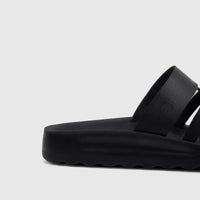 Black PC Ladies Casual Sandal PCL11018 with textured two-strap upper and wavy sole detail, viewed from the side.