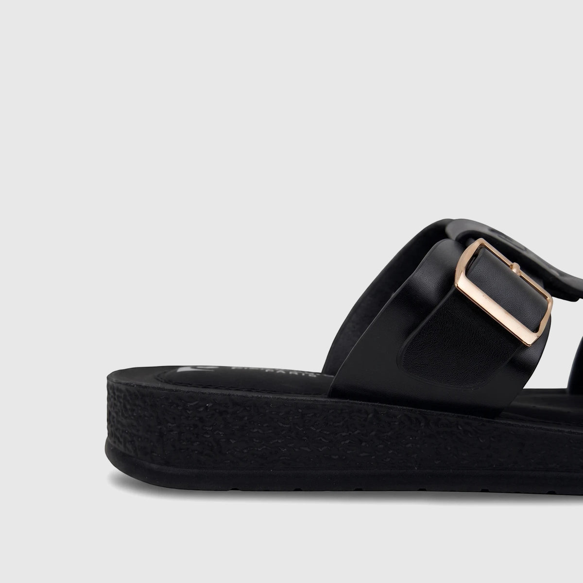 Close-up of a PC Ladies Casual Sandal PCL10971 in black, featuring a thick platform sole and a gold buckle on the strap.