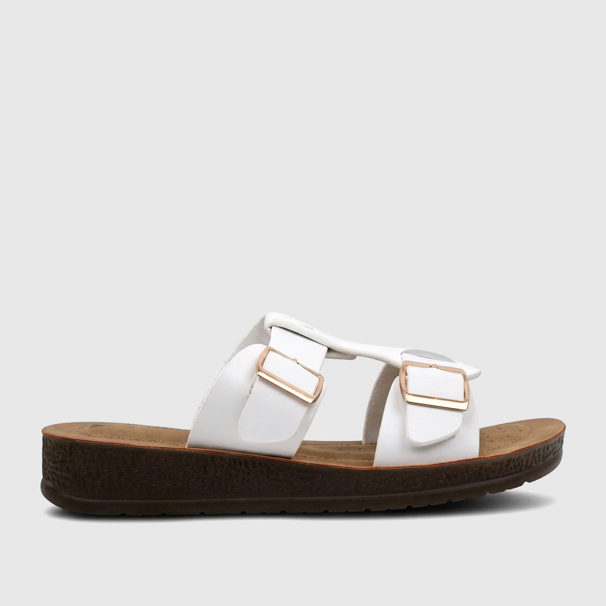 White PC Ladies Casual Sandal with gold buckles and a textured dark brown platform sole, shown from the side.