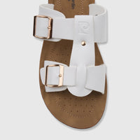 Close-up top view of a white PC Ladies Casual Sandal with two gold buckles and a brown contoured footbed.