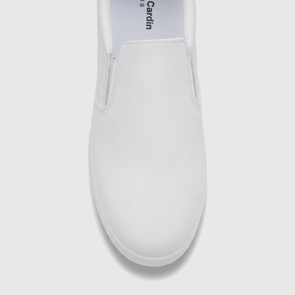 White PC Ladies casual slip-on sneaker, PCL11019, shown from a close-up front view, highlighting the clean design.