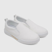 A pair of white PC Ladies Casual Slip On Sneakers, featuring gold branding details, displayed in a slightly elevated side