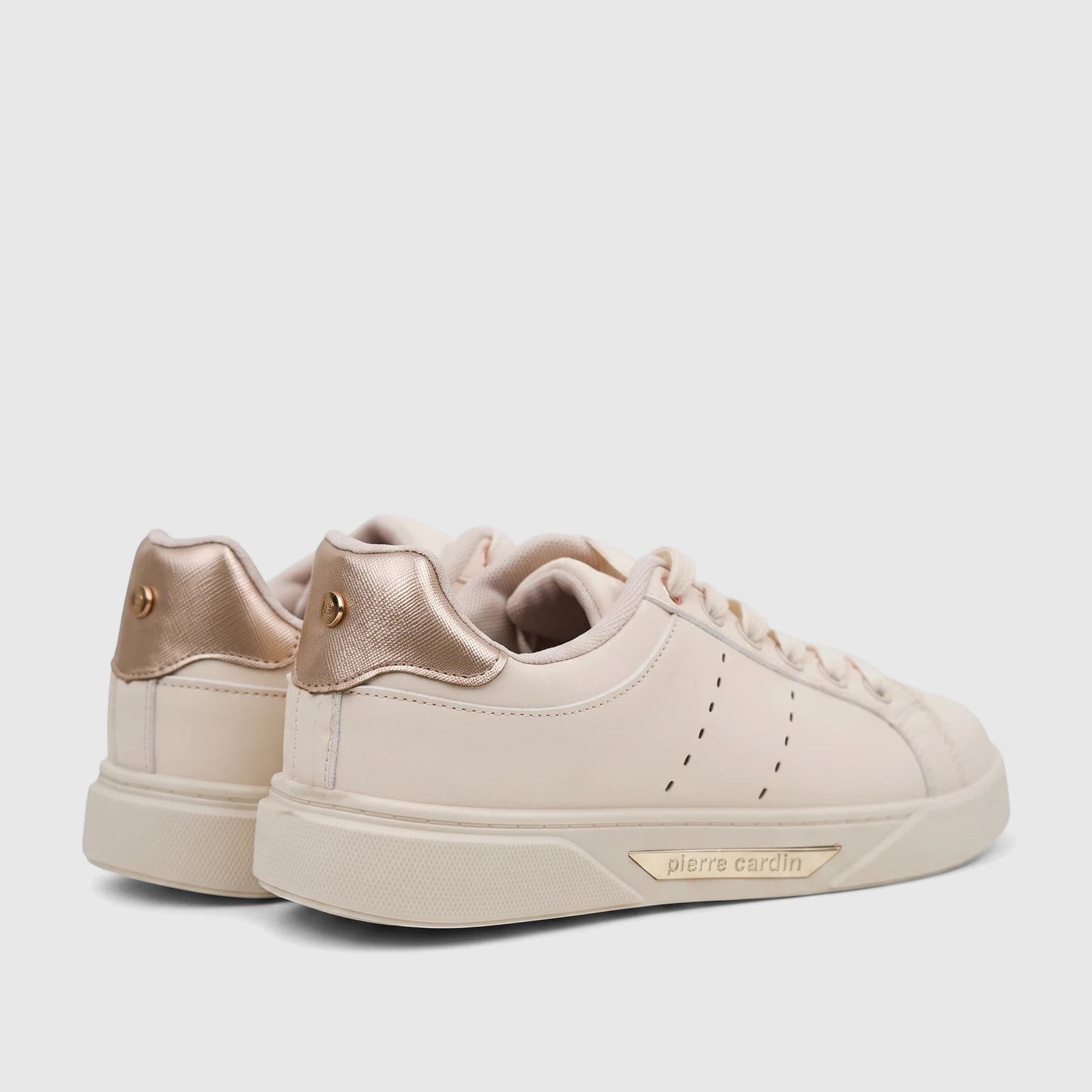 A pair of beige Pierre Cardin ladies' casual sneakers with gold accents and laces, viewed from a low rear angle.